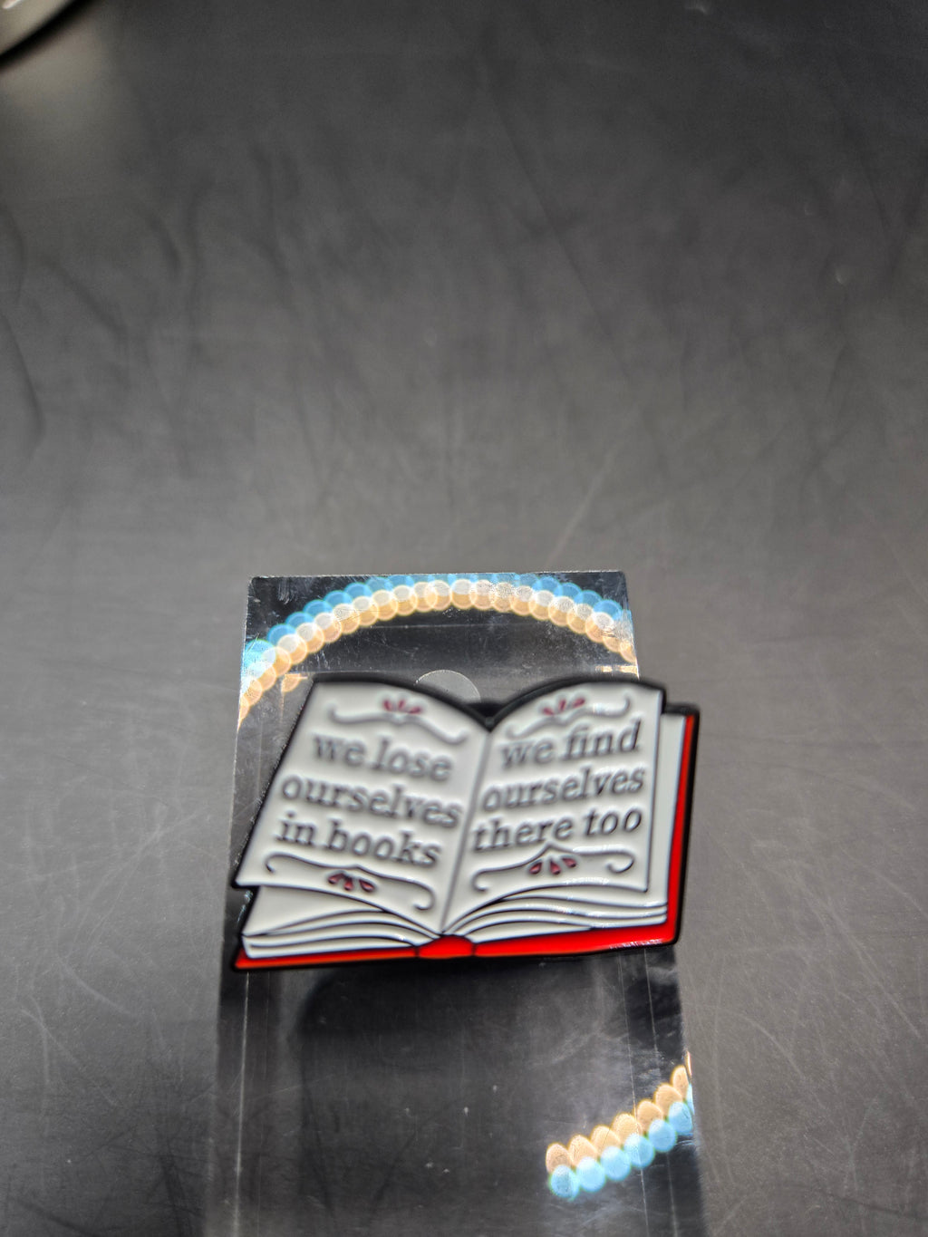 We Lose Ourselves In Books Pin