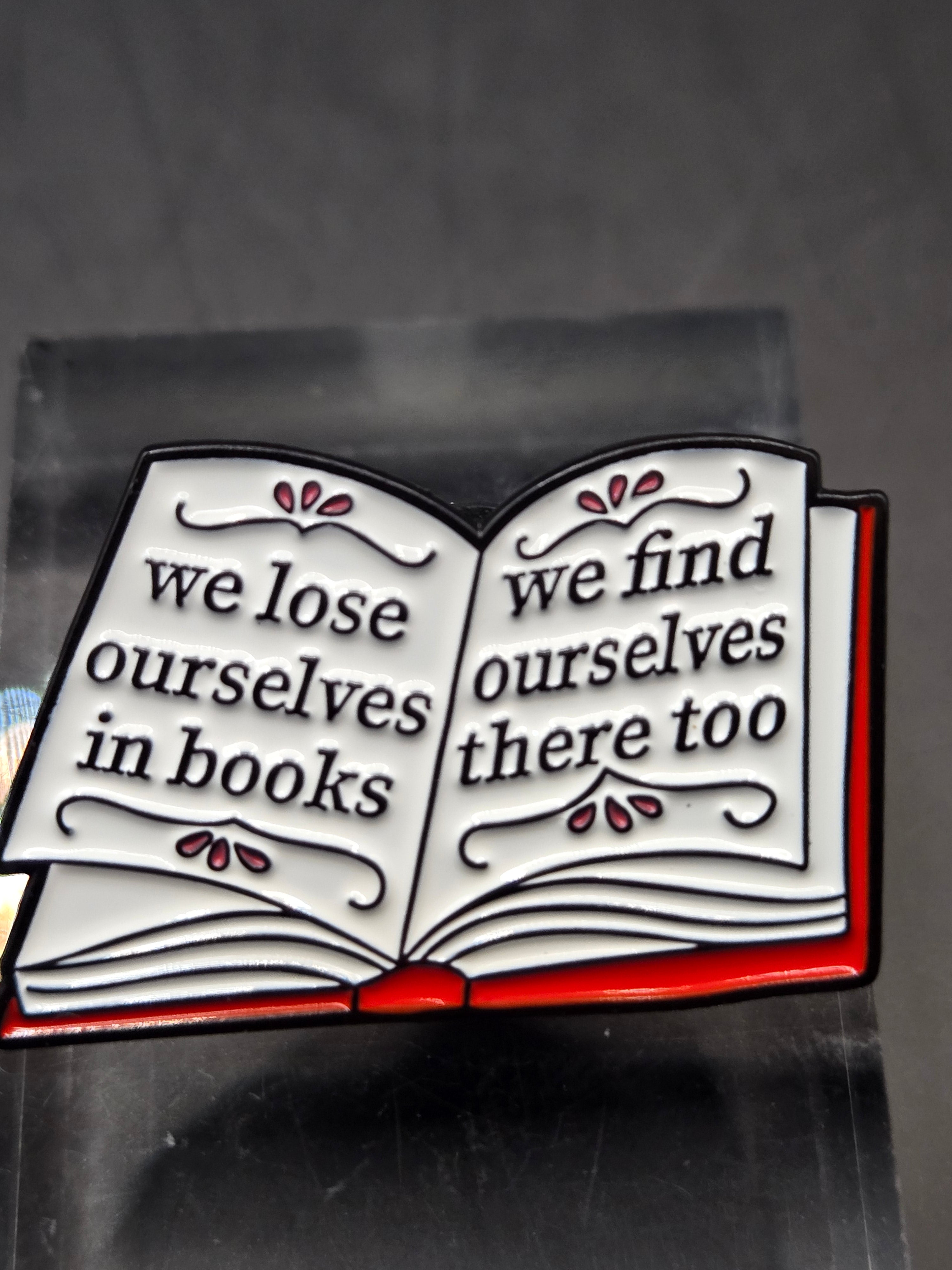 We Lose Ourselves In Books Pin