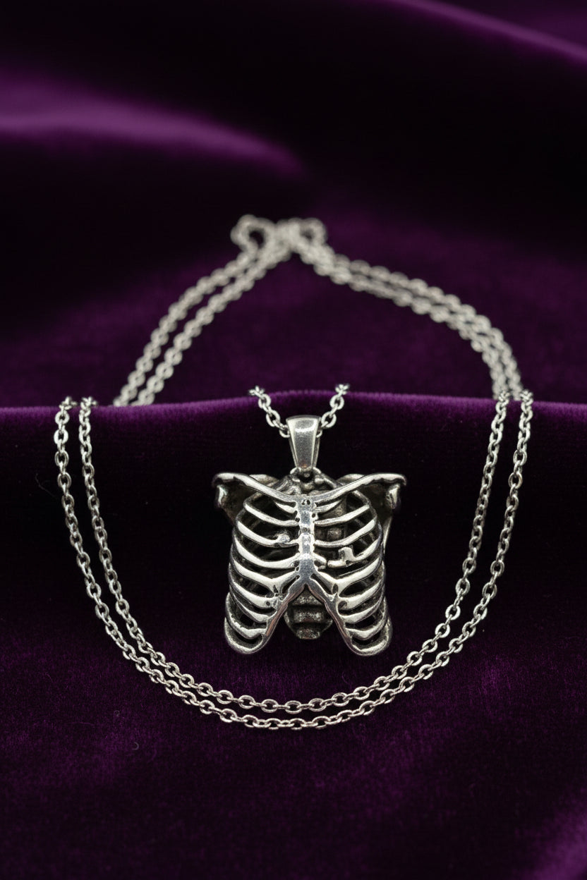 MR. BONES' RIB CAGE/CRYSTAL HEART PENDANT
